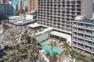 an aerial view of a large building with a swimming pool at The Island Gold Coast in Gold Coast