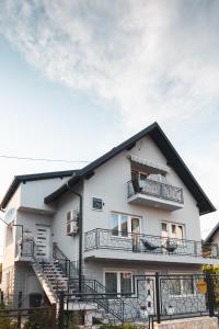 a white building with balconies on the side of it at Apartmani Vesna Tuheljske toplice in Tuheljske Toplice