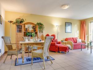 a living room with a table and chairs at Ostseeresidenz - Whg 11 in Zingst