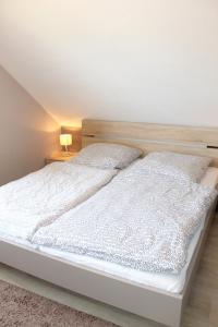 Кровать или кровати в номере Ferienwohnung Steffens - "Im Winkel"