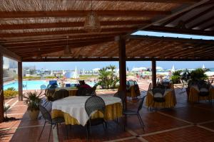 A restaurant or other place to eat at Baia dei Mulini Resort & Spa