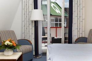 Ein Bett oder Betten in einem Zimmer der Unterkunft Hotel Seeschwalbe