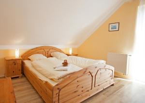 En eller flere senge i et værelse på Ferienwohnung Rothaarsteig in Winterberg-Neuastenberg