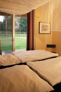 Ένα ή περισσότερα κρεβάτια σε δωμάτιο στο Kamaahr