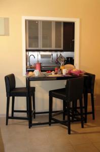 a kitchen with a table and chairs in a kitchen at Kamaahr in Friedenstal