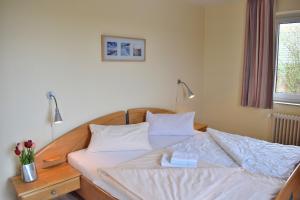 Ένα ή περισσότερα κρεβάτια σε δωμάτιο στο Am Hinrichsberg unten