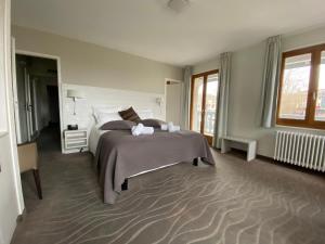 Postelja oz. postelje v sobi nastanitve Auberge de Confignon