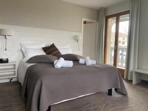 Postelja oz. postelje v sobi nastanitve Auberge de Confignon