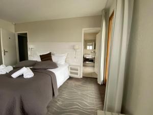 Postelja oz. postelje v sobi nastanitve Auberge de Confignon