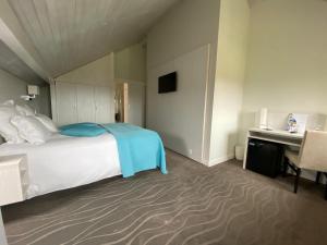 Postelja oz. postelje v sobi nastanitve Auberge de Confignon