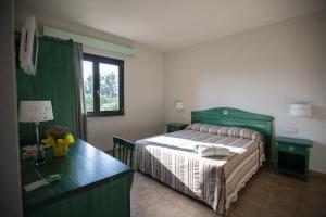 A bed or beds in a room at Le Vanille