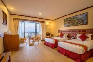 Giường trong phòng chung tại Rupakot Resort