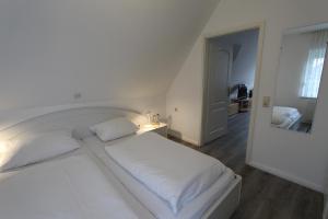 Postel nebo postele na pokoji v ubytování Haus Seepferdchen - Whg 9