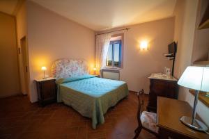 Postel nebo postele na pokoji v ubytování Cavarchino B&B