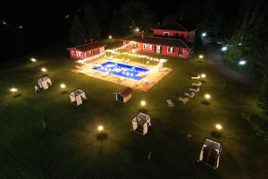 an aerial view of a house with a swimming pool at night at Agriturismo Borgo Imperiale in Valmontone