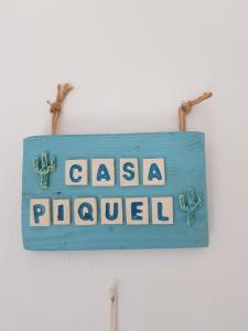 a blue sign on a wall with the words salsaoked at Casa Piquel in Corralejo