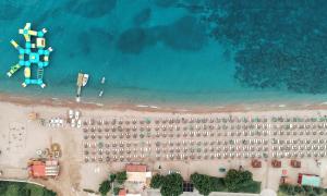 an aerial view of a beach with a resort at Mitsis Selection Blue Domes in Kardamaina