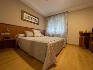 Giường trong phòng chung tại Hotel Cies