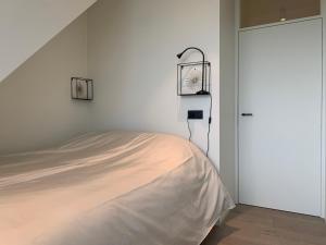 Postel nebo postele na pokoji v ubytování Koekeloeren