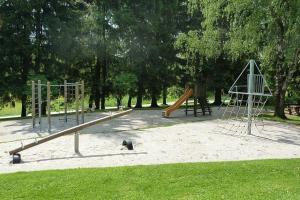 a park with a playground with a slide at Ferienhaus Nr 8D, Feriendorf Hagbügerl, Bayr Wald in Waldmünchen