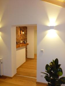 a living room with a light on the wall at Ferienwohnung Uferweg in Fischbachau