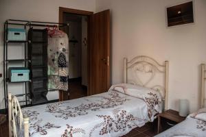Ένα ή περισσότερα κρεβάτια σε δωμάτιο στο La Titina Casa Vacanza