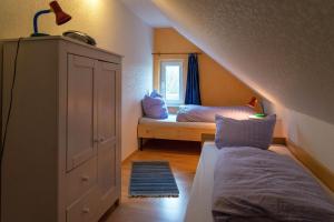 Postel nebo postele na pokoji v ubytování Ferienwohnung FLUT in Carolinensiel