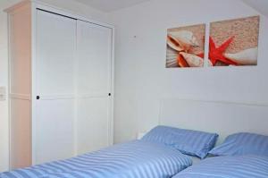 Postel nebo postele na pokoji v ubytování Ferienwohnung FLUT in Carolinensiel