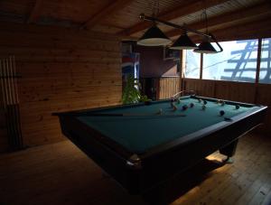 a billiard room with a pool table in a room at Hotel Sofia in Marathokampos