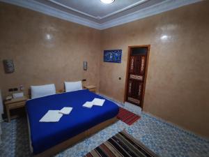 Voodi või voodid majutusasutuse Riad Fennec Sahara toas