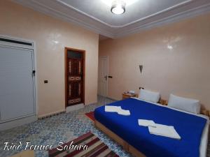 Voodi või voodid majutusasutuse Riad Fennec Sahara toas