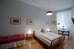Кровать или кровати в номере Cassiodoro19