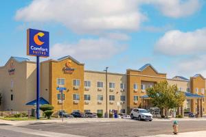 a building with a sign for a carolina suites at Comfort Suites Victorville-Hesperia in Victorville