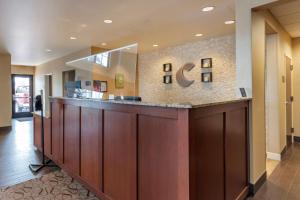 a lobby with a reception counter in a hospital at Comfort Suites Airport-University in Bozeman