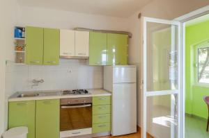 Kuchyňa alebo kuchynka v ubytovaní Seafront Apartments Olivera