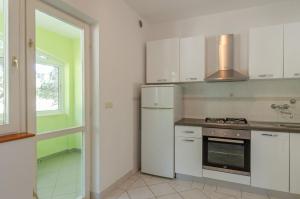 Kuchyňa alebo kuchynka v ubytovaní Seafront Apartments Olivera