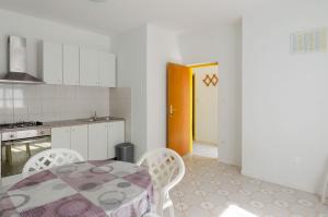 Kuchyňa alebo kuchynka v ubytovaní Seafront Apartments Olivera