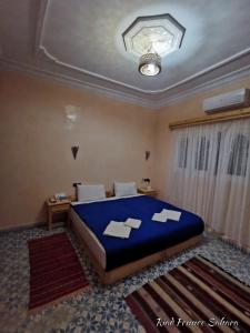 Кровать или кровати в номере Riad Fennec Sahara