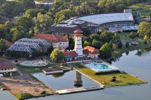 an aerial view of a building with a lighthouse at Körmendi Apartman in Orosháza
