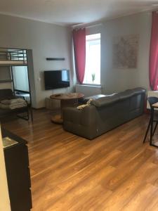 Televízia a/alebo spoločenská miestnosť v ubytovaní apartament Śródmieście 1 sypialnia oraz 1 salon