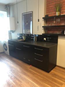 Kuchyňa alebo kuchynka v ubytovaní apartament Śródmieście 1 sypialnia oraz 1 salon