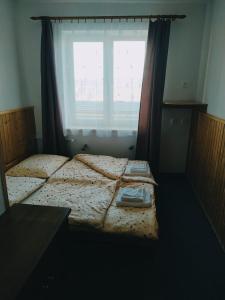 Posteľ alebo postele v izbe v ubytovaní Penzion Vysočina