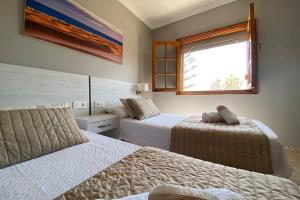 Ένα ή περισσότερα κρεβάτια σε δωμάτιο στο 2 Apartments with private pool at Villa Diaz Aleman +33 φωτογραφίες