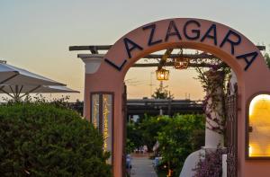 an entrance to a restaurant with a sign that reads zaza at Boutique Hotel Casa Mariantonia in Anacapri