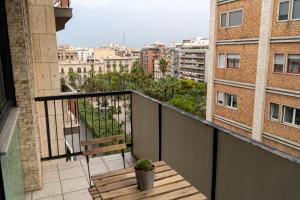 a balcony with a bench and a view of a city at Via Sparano Suite in Bari