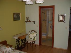 A bed or beds in a room at Bundi Vendégház