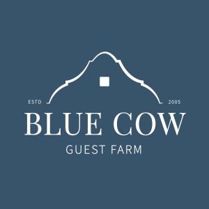 a blue cow guest farm logo at Blue Cow Barn - Boutique Farm in Barrydale