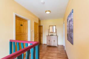 a room with a staircase and a hallway with a door at Haus Gerd Janssen Wohnung 1 in Spiekeroog