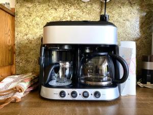 a black and white coffee maker on a counter at Bauernhaus Moser in Nötsch