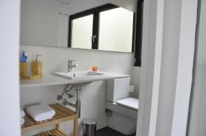 a bathroom with a sink and a mirror at Apartament La Placeta Figueres in Figueres +30 photos